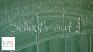 Image of blackboard displaying the words: 'School's out' in white chalk