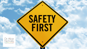 Picture of a yellow 'safety first' sign on a blue background